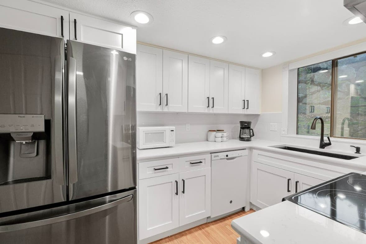 The fully-equipped kitchen features modern appliances and ample counter space.