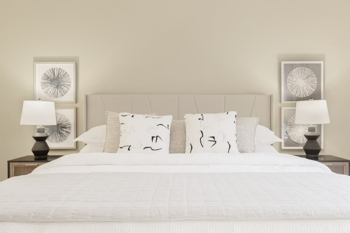 The tranquil bedroom ensures restful sleep with a plush bed and soft linens