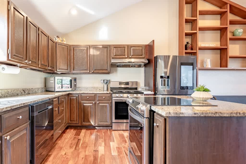 Warm and inviting kitchen featuring rich brown wood interiors that create a cozy cooking haven.