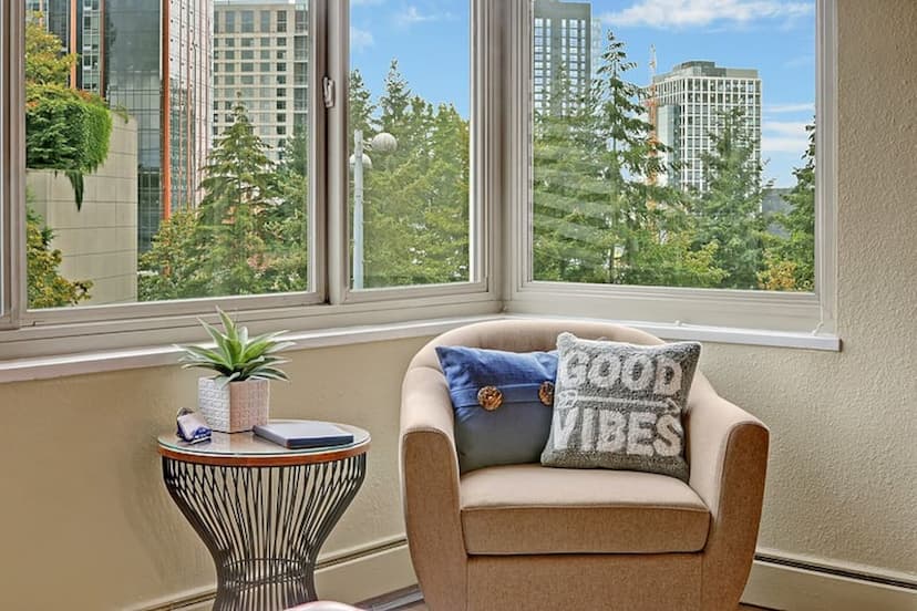 Cozy reading nook with city views, perfect for morning coffee or winding down with a book. Filled with light and good vibes.