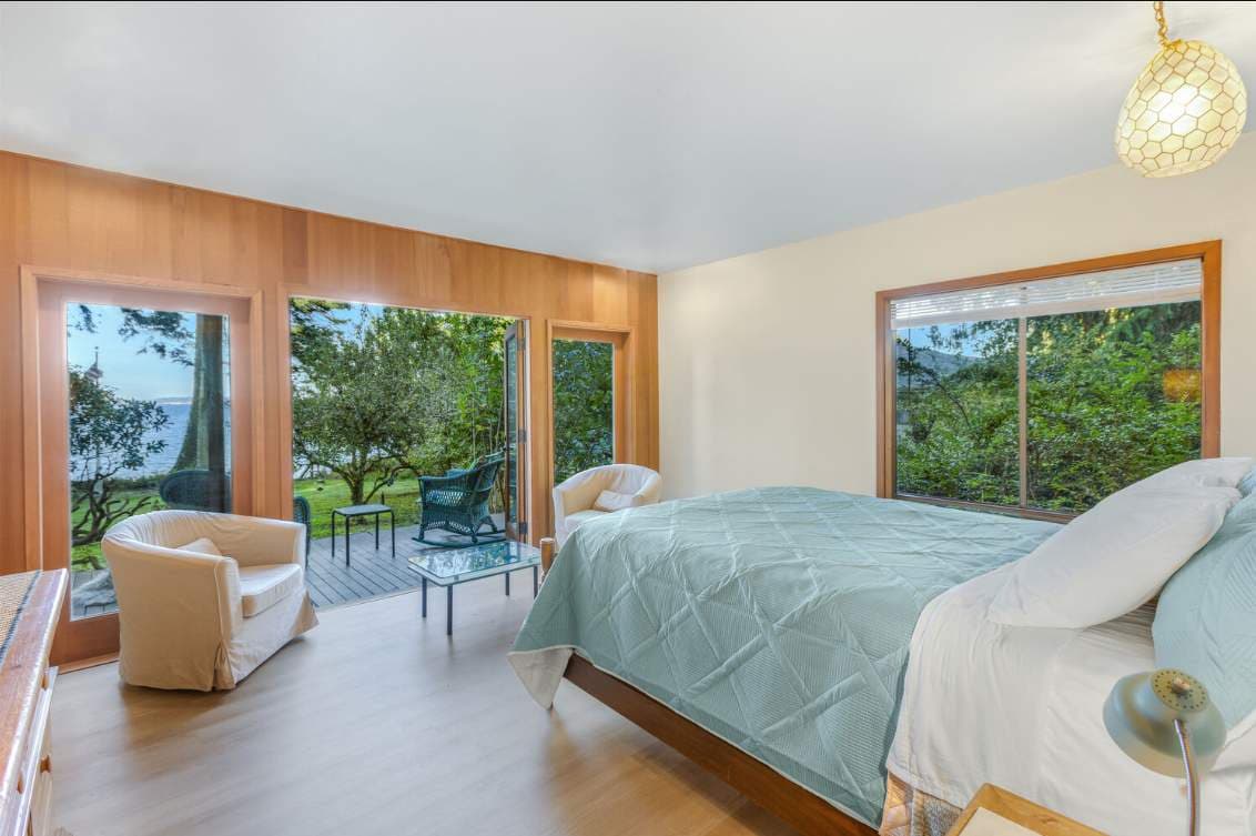 A tranquil master suite where the scenery steals the show and relaxation comes naturally.