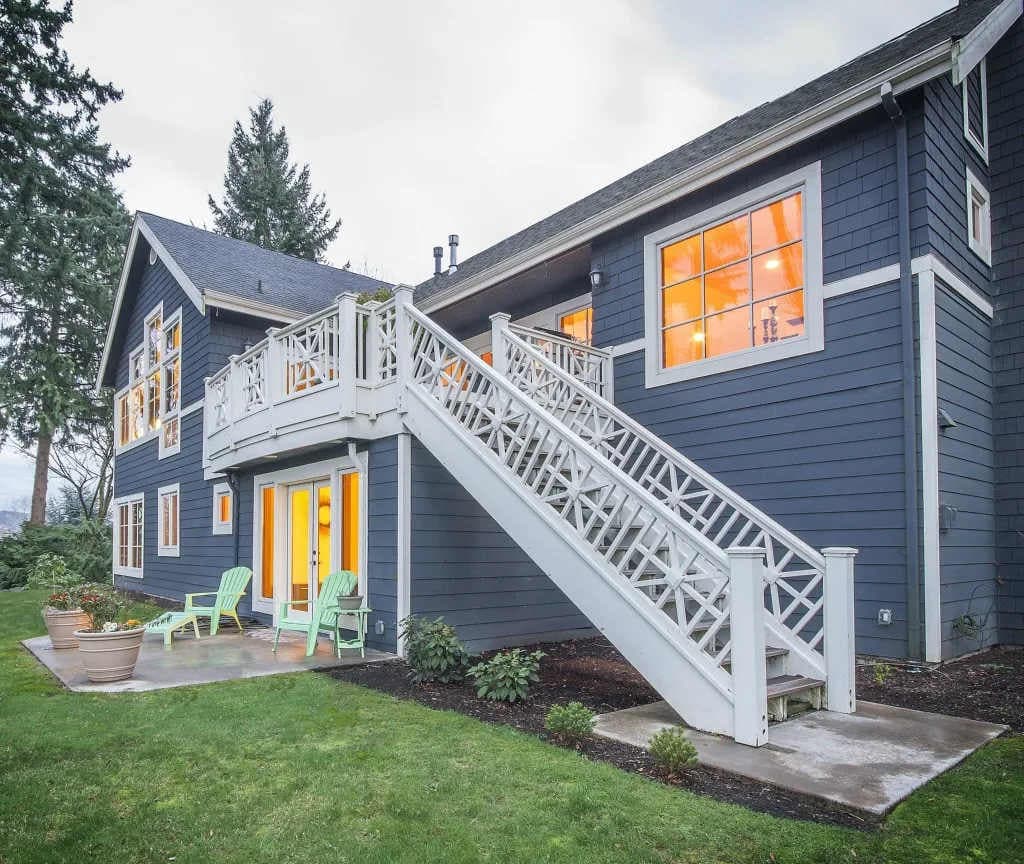 The dark, inviting facade promises a secluded escape nestled among the greenery.