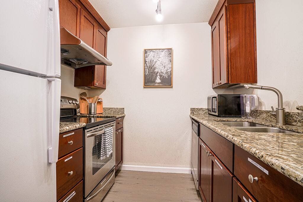 The fully upgraded kitchen comes stocked with everything you need to cook meals during your stay.