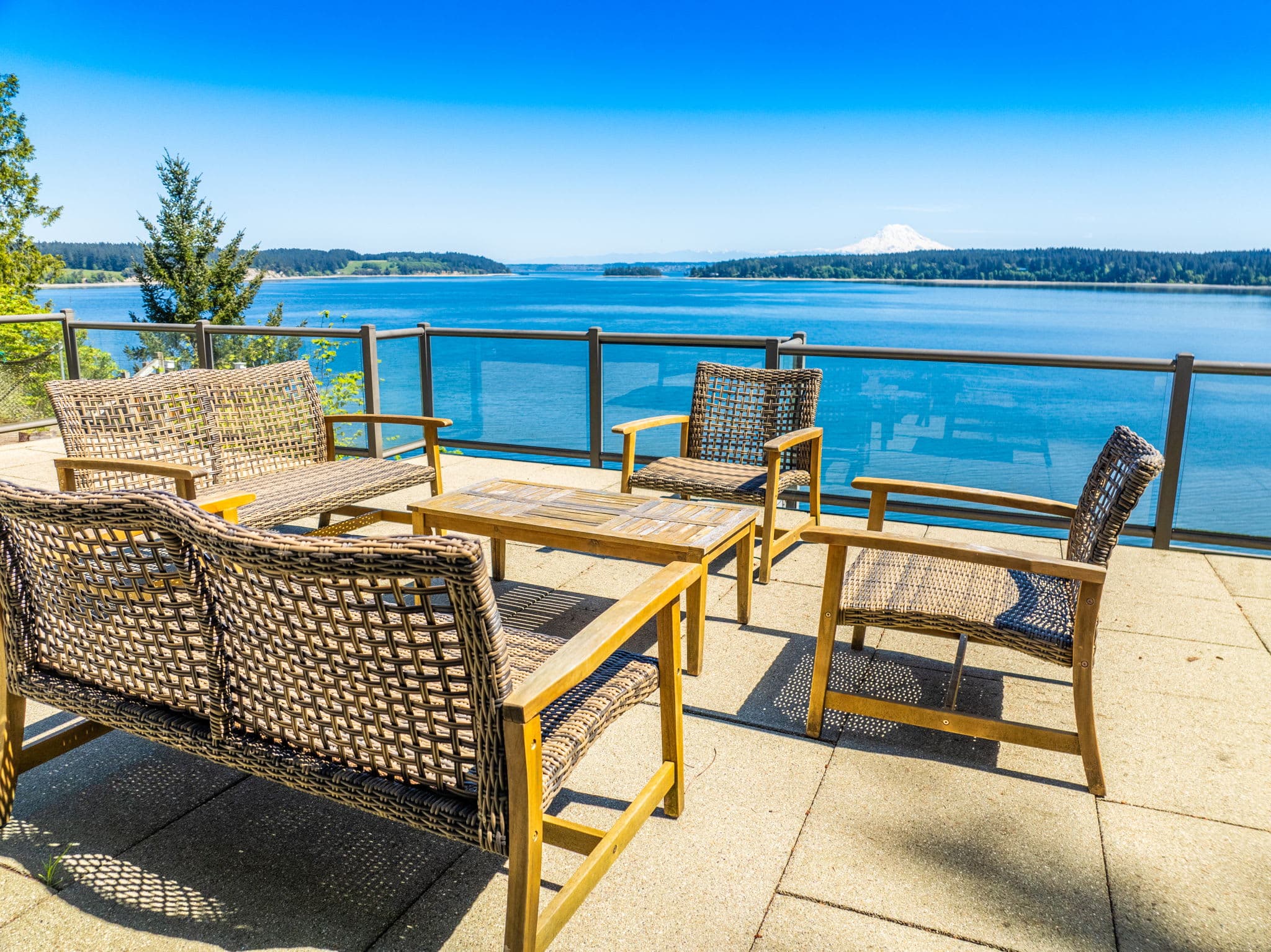 Immersed in nature with our outdoor deck with breathtaking views of both the water and Mount Rainier
