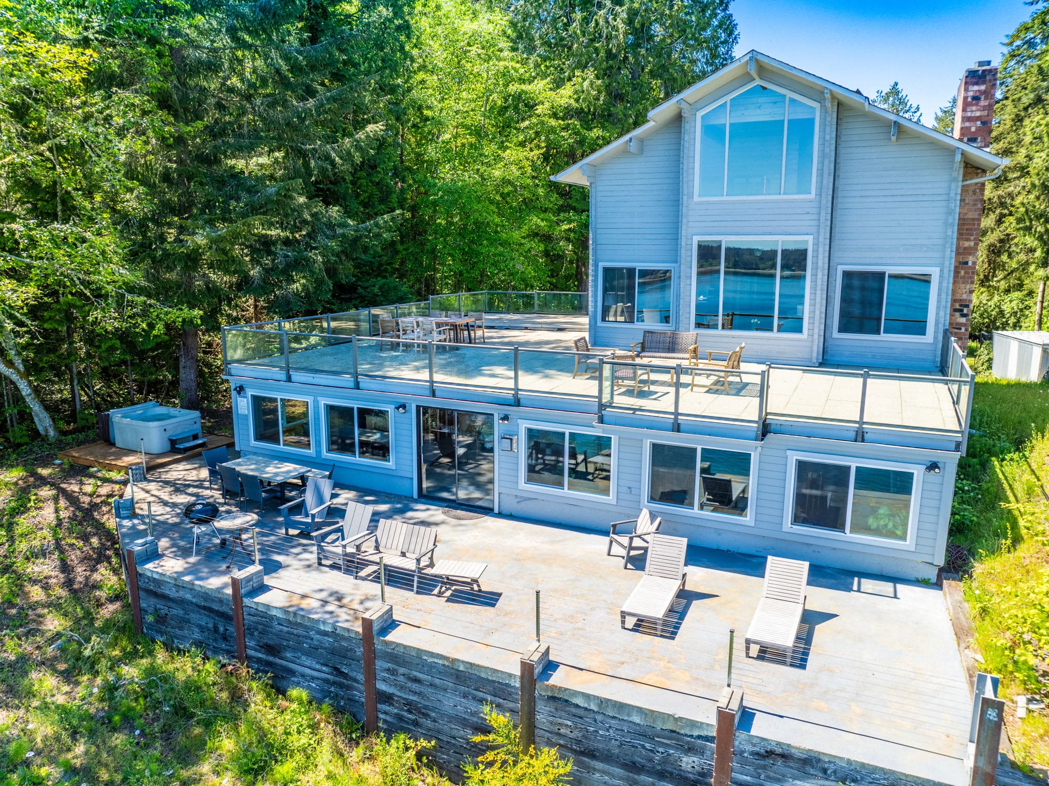 Step onto the spacious deck and enjoy breathtaking views from the comfortable outdoor seating, perfect for family gatherings and unforgettable memories