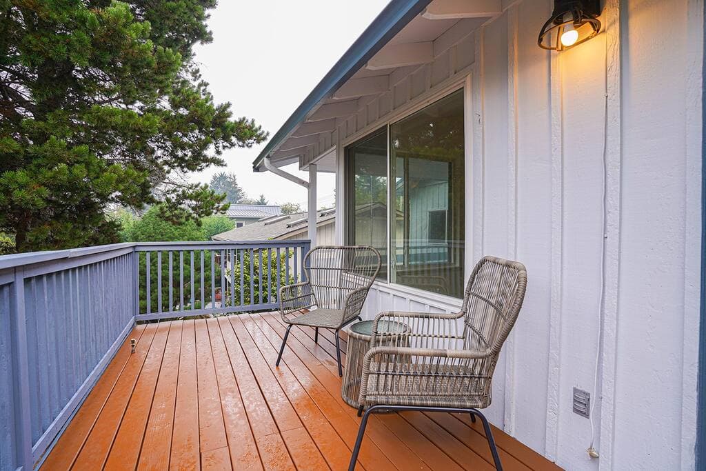 The living room opens up to a deck overlooking the backyard. Enjoy your morning coffee or evening drinks here.