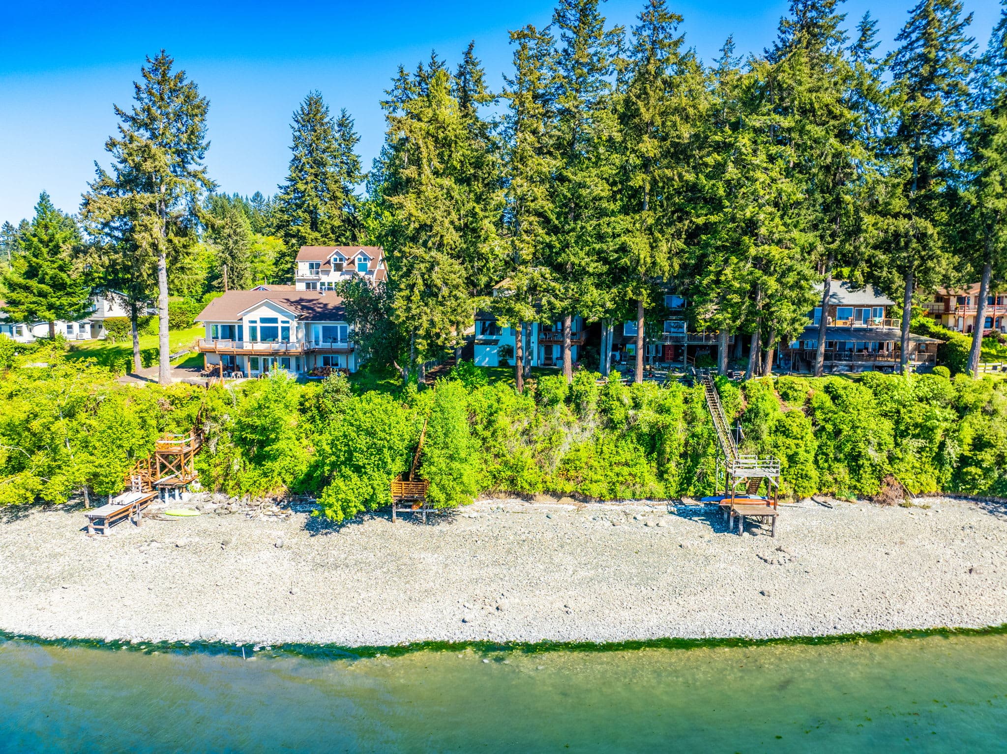 In addition to the pristine bay views from inside the home, there is a 50-foot beachfront where you can go kayaking.