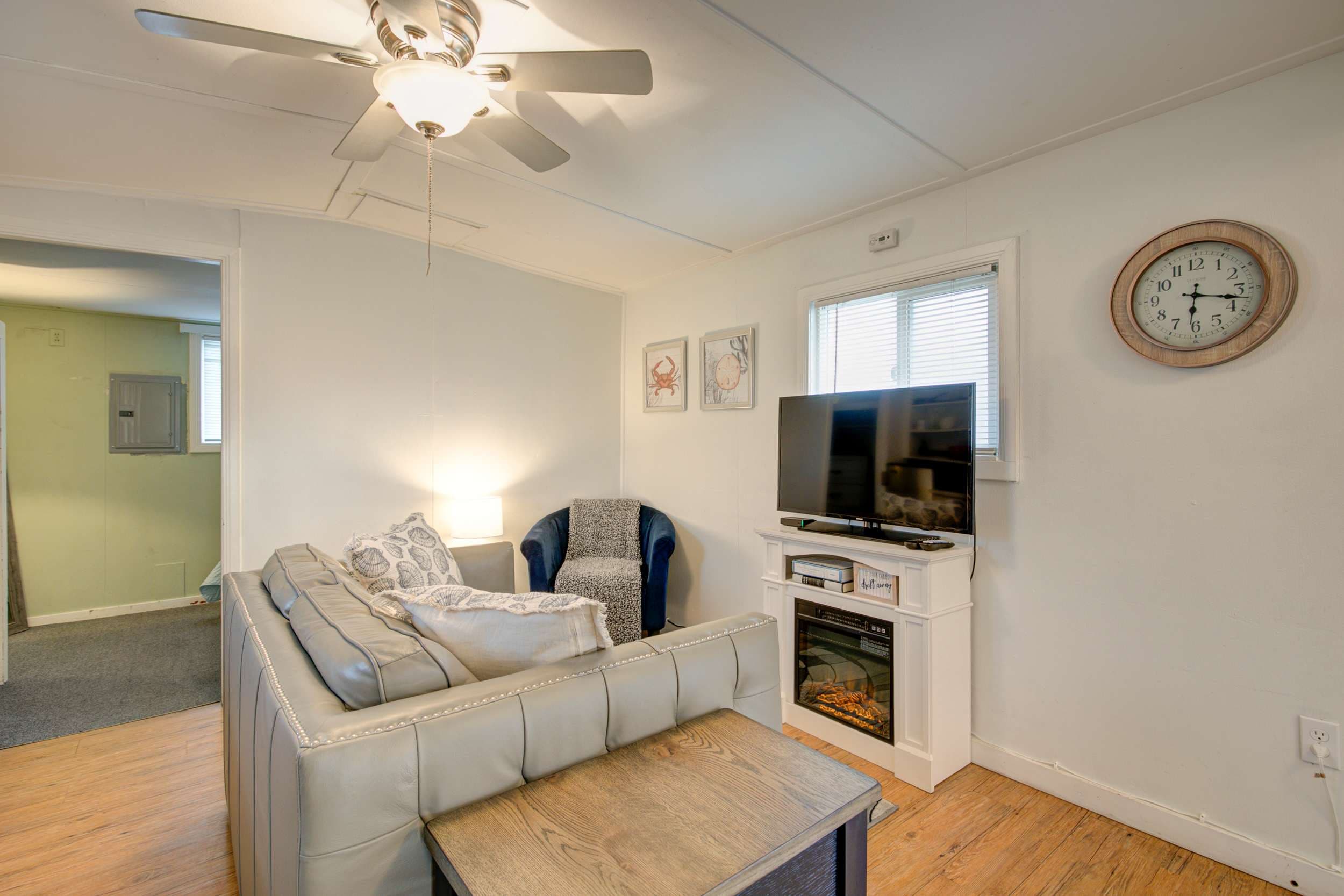 Cozy living room with seating and a TV, ideal for relaxation and entertainment.