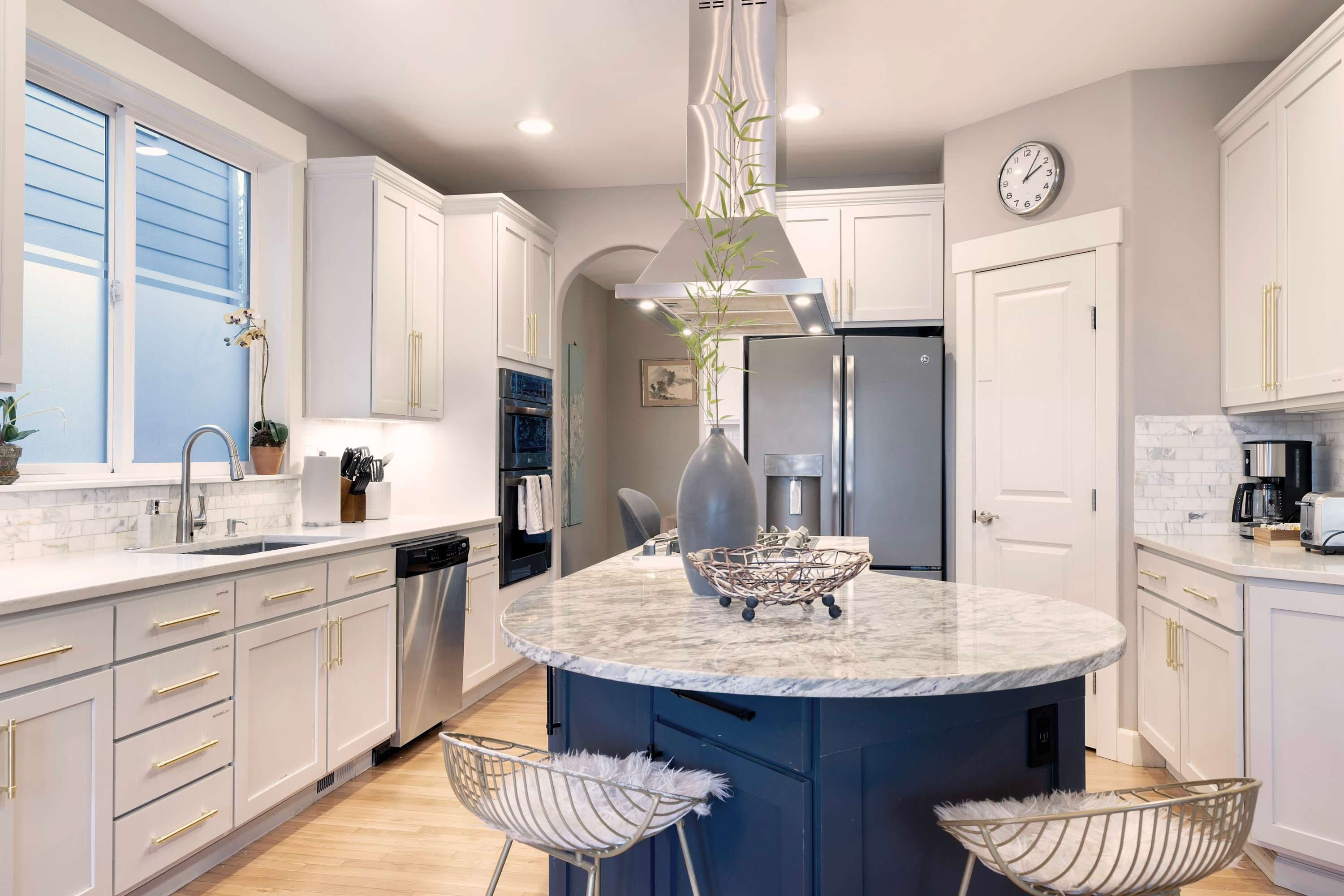 The open-concept kitchen seamlessly connects to the space, making it ideal for both cooking and entertaining