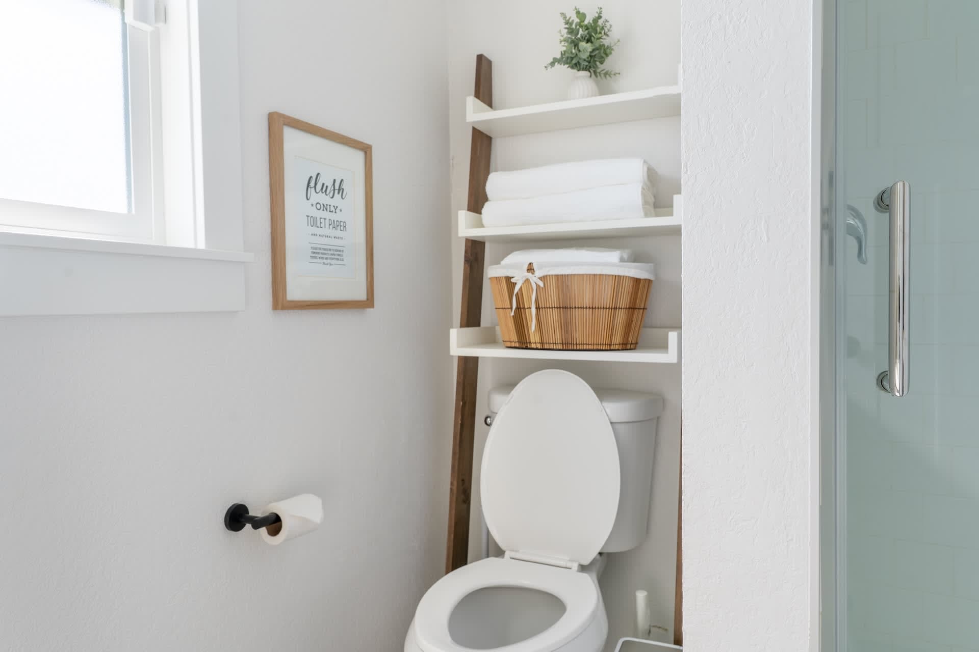 The bathroom features a clean, modern design that offers a refreshing and comfortable experience.