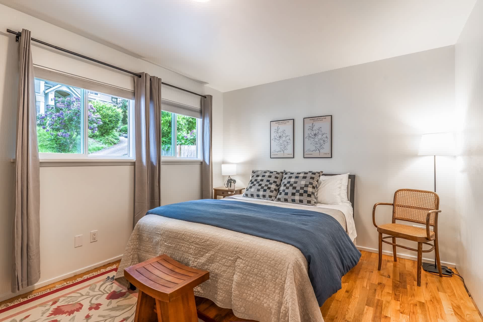 Bright white walls meet the timeless warmth of wood beneath.