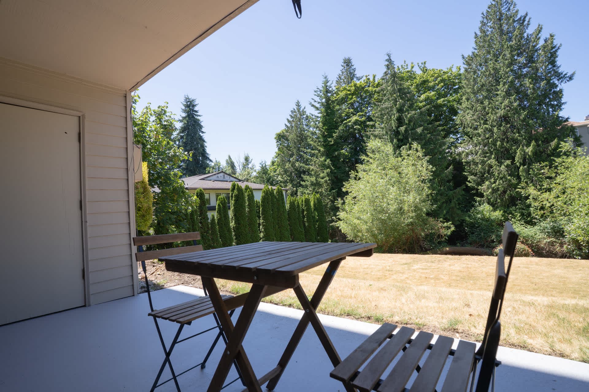 Simple and inviting deck setup, ideal for sipping coffee or sharing a quiet chat.