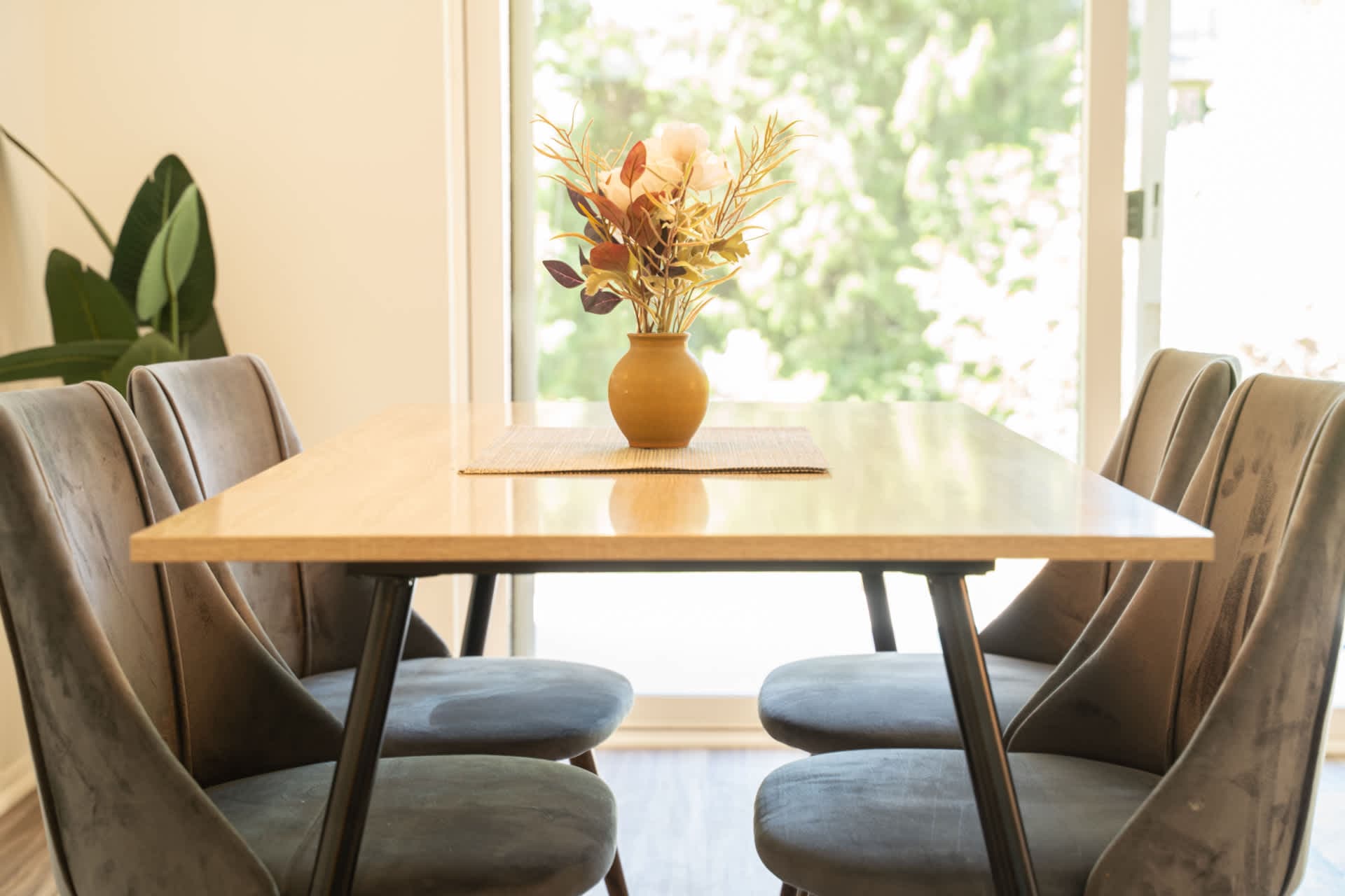 Enjoy sunlit meals in a bright kitchen and cozy 4-seater dining area.